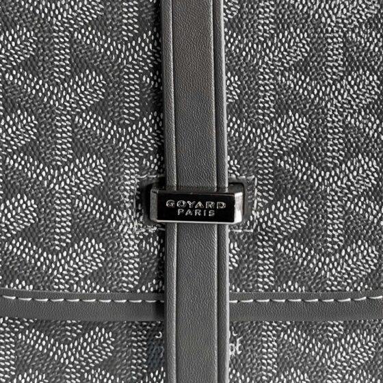 Grey Goyard bag by Central ae, showcasing its signature pattern and structured design.