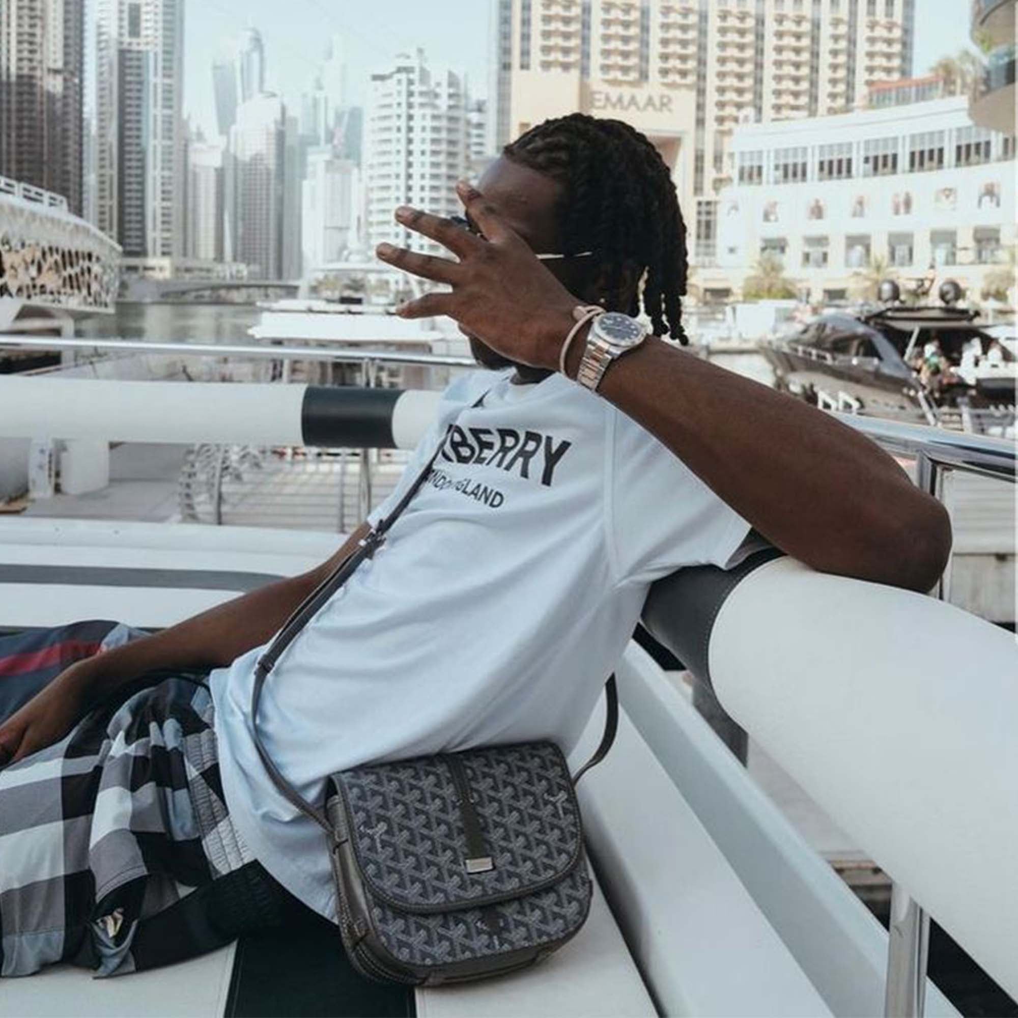 Grey Goyard bag featuring a classic design and signature pattern from Central ae, displayed against a neutral background.