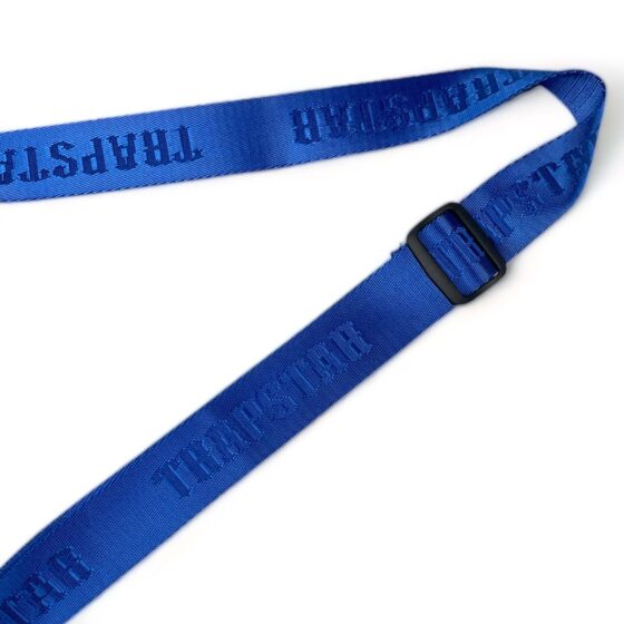 Trapstar Irongate T blue crossbody bag with adjustable strap and logo detail on the front.