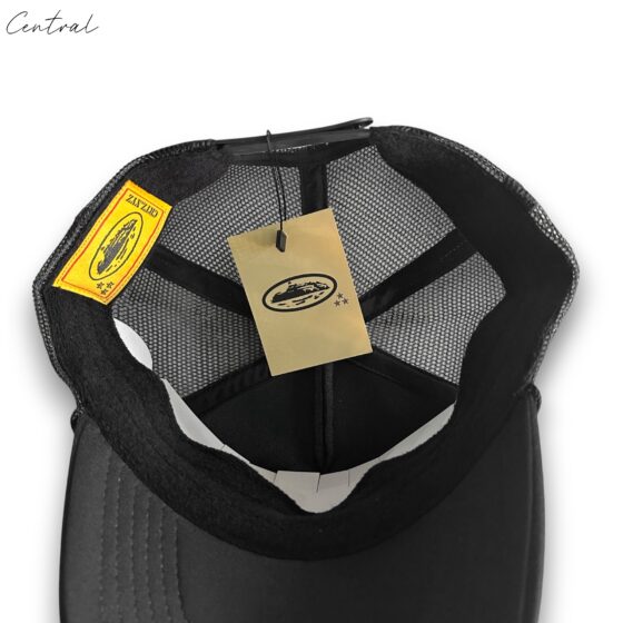 Black Corteiz cap by Central ae, featuring a classic design and adjustable strap for a comfortable fit.