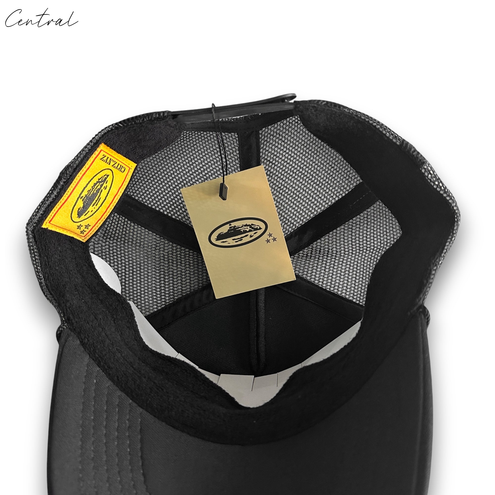 Black Corteiz cap by Central ae, featuring a classic design and adjustable strap for a comfortable fit.