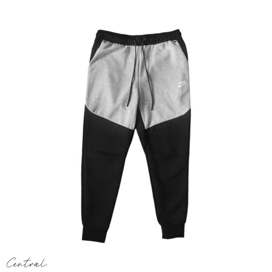 Nike Tech Fleece grey and black tracksuit set featuring a hoodie and pants, showcased on a neutral background.
