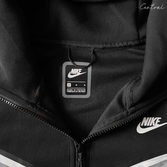 Nike Tech Fleece tracksuit in grey and black, featuring a comfortable hoodie and matching pants set.