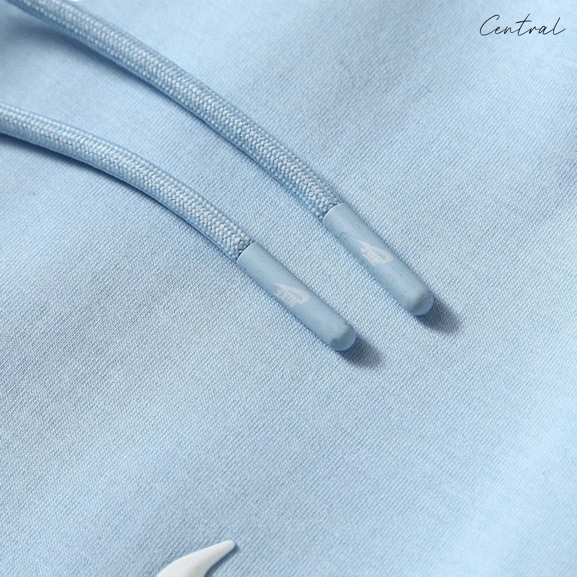 Central ae NOCTA Tech Fleece hoodie and pants set in black, featuring a relaxed fit and soft fabric texture.