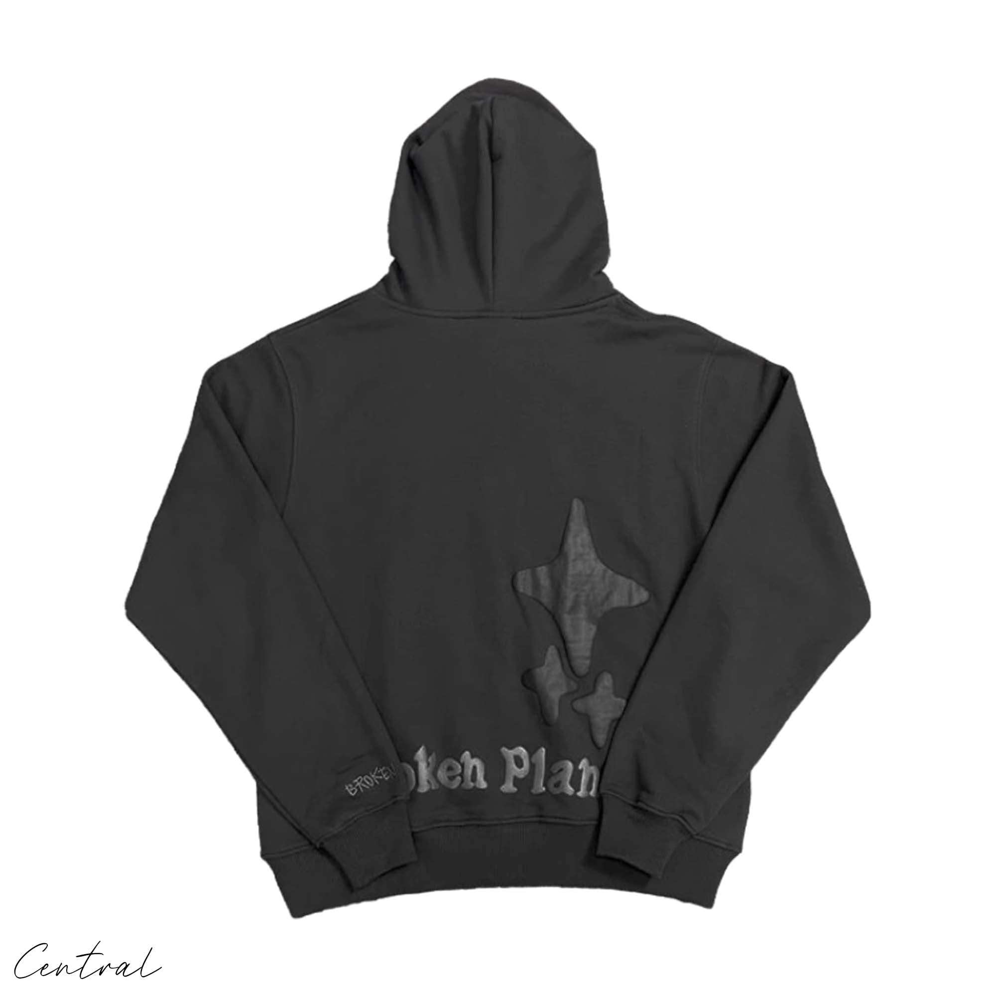 Central ae Broken Planet Out of the Shadows hoodie in dark color with graphic design on the front and drawstring hood.
