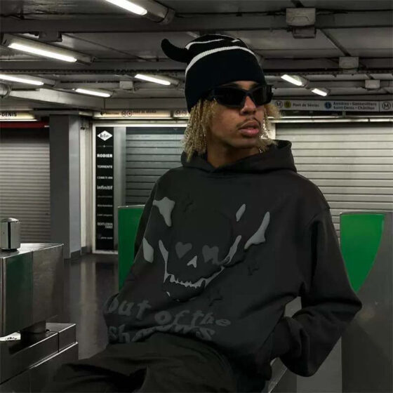 Central ae Broken Planet Out of the Shadows hoodie featuring a dark design and comfortable fit.