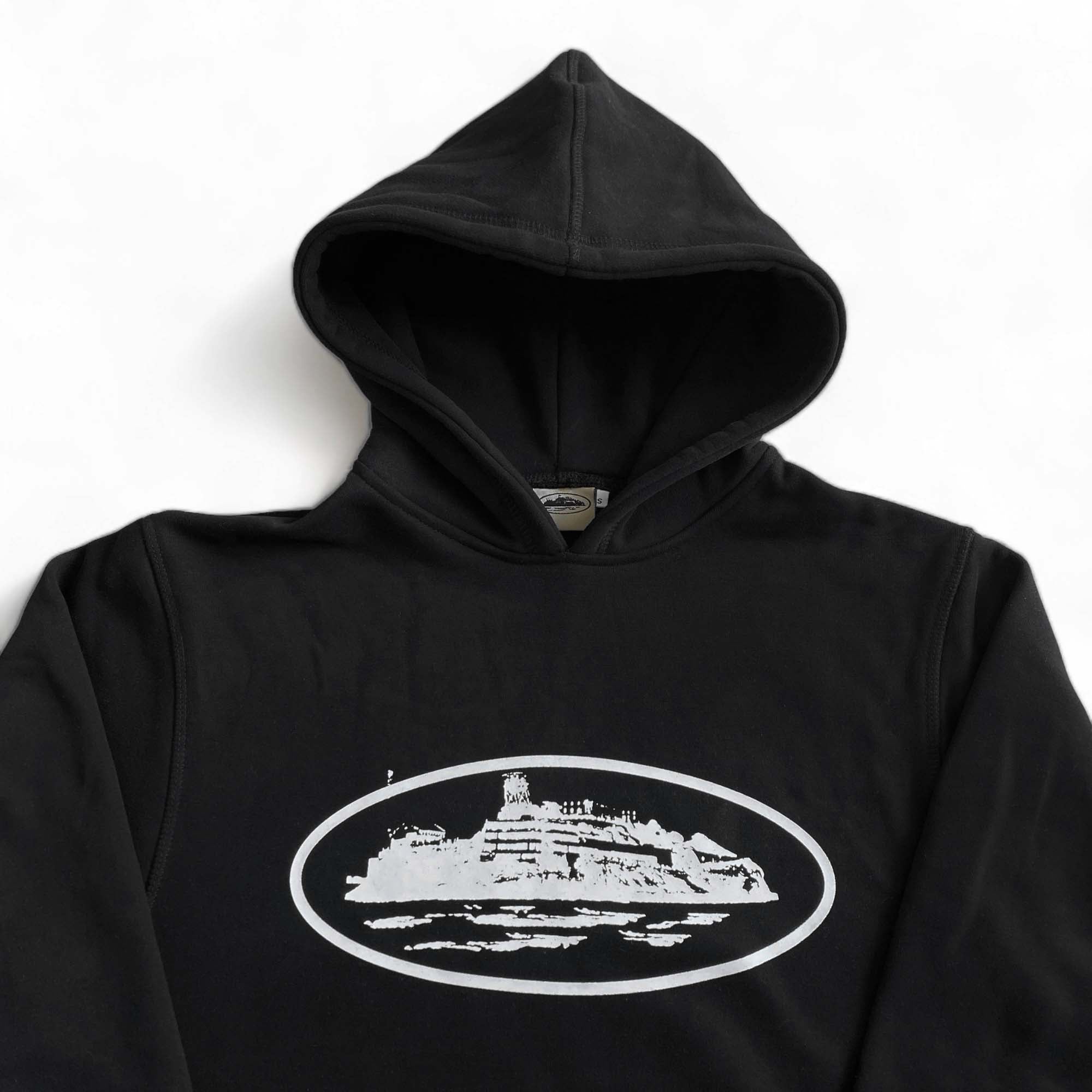 Black Corteiz Alcatraz hoodie featuring a minimalist design and a cozy fit, perfect for casual wear.
