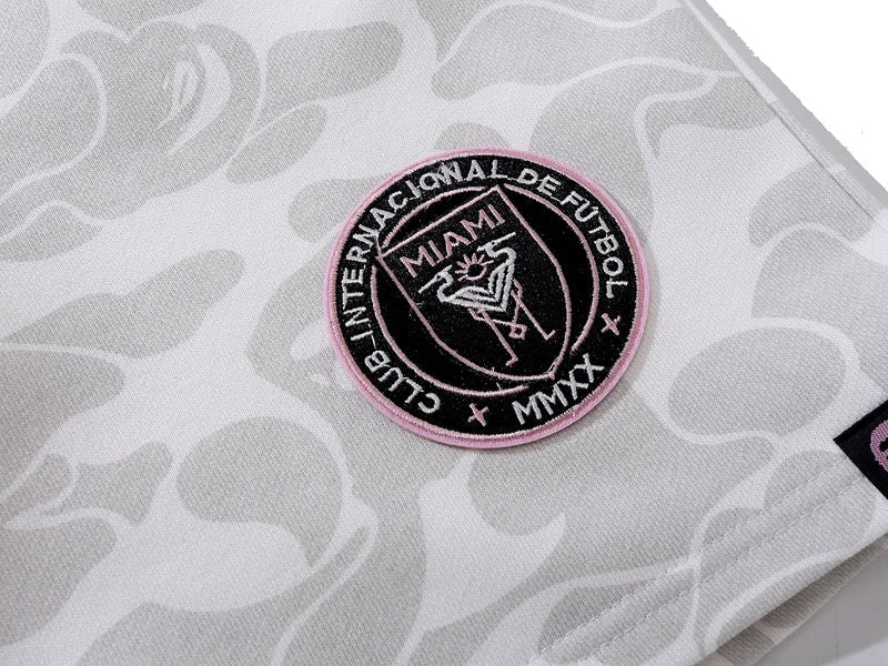 BAPE x Inter Miami white camo shorts featuring a unique camouflage pattern and relaxed fit by Central ae.