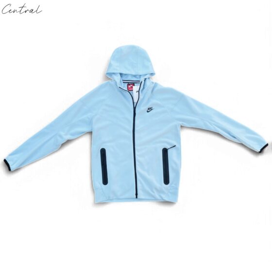 Baby blue Nike Tech Fleece tracksuit featuring a cozy hoodie and jogger pants for infants.