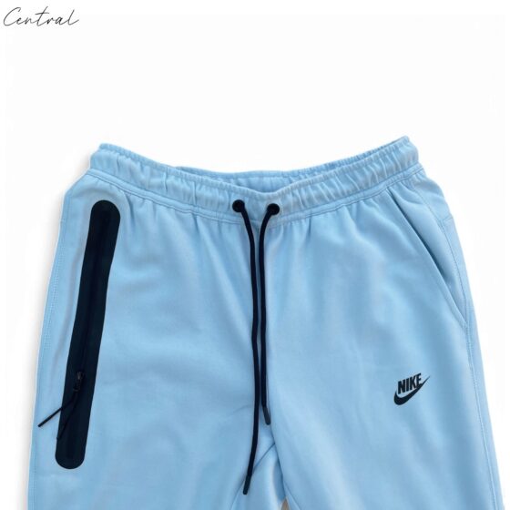 Baby blue Nike Tech Fleece tracksuit featuring a zip-up jacket and matching pants for infants.