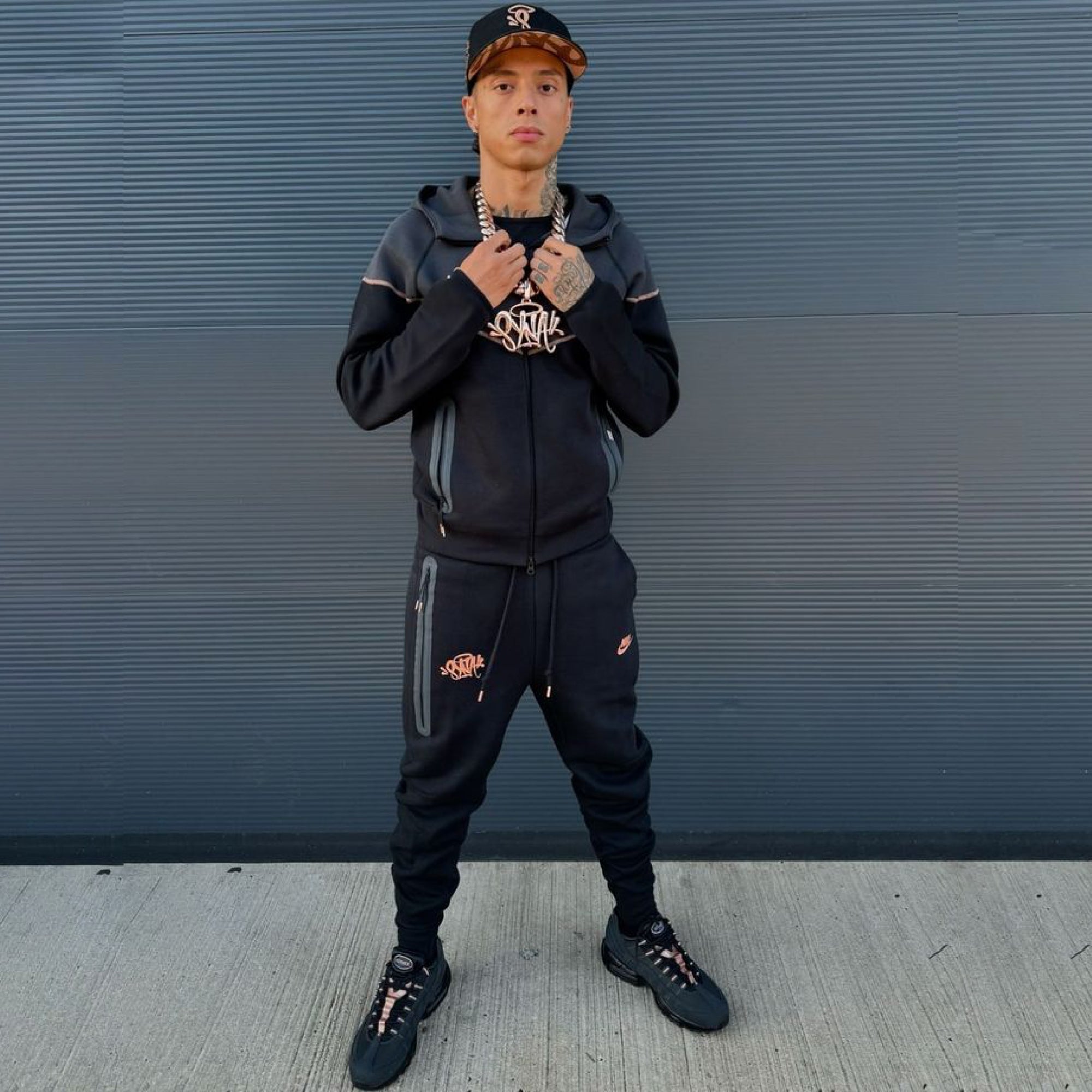 Nike x Central Cee Tech Fleece hoodie in gray with logo, featuring a relaxed fit and soft fleece material.