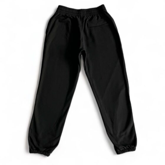 Corteiz Alcatraz black sweatpants featuring a relaxed fit and elastic waistband, perfect for casual wear.