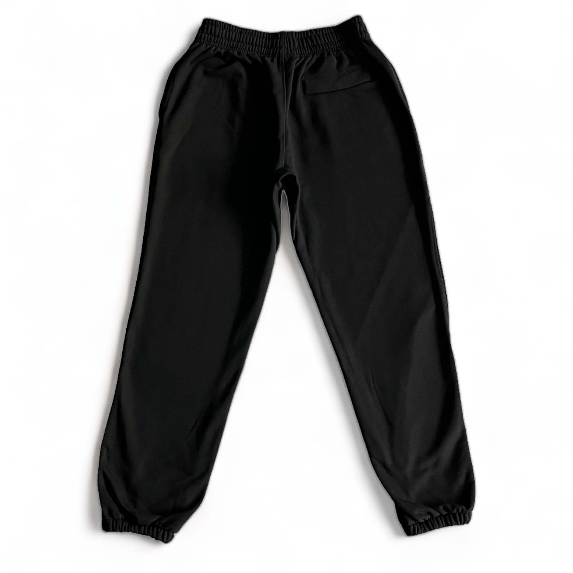 Corteiz Alcatraz black sweatpants featuring a relaxed fit and elastic waistband, perfect for casual wear.