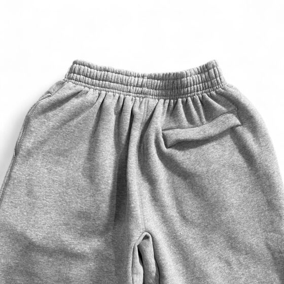 Gray Corteiz Alcatraz sweatpants featuring a relaxed fit and drawstring waistband, ideal for casual wear.