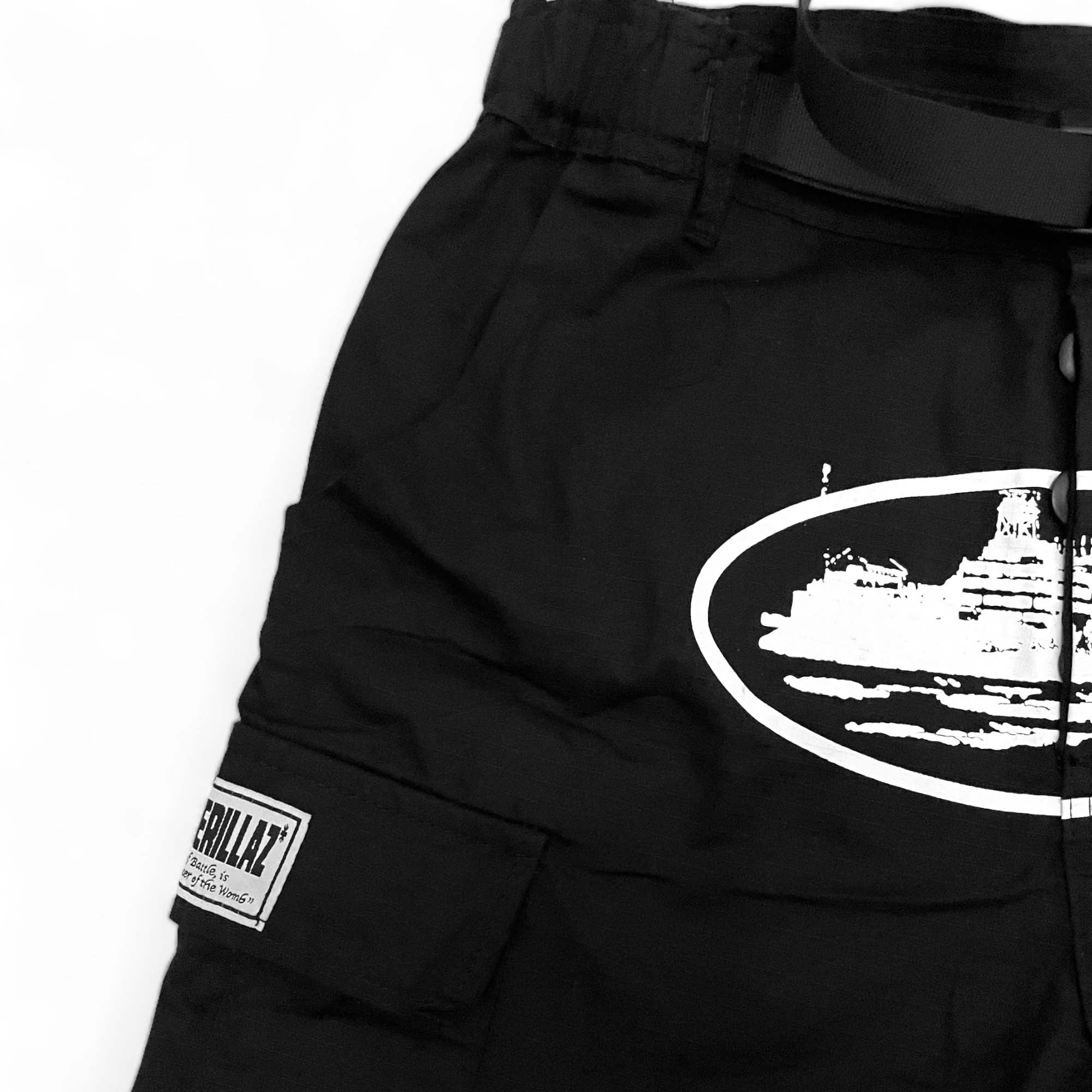 Corteiz cargo pants in olive green with multiple pockets and a relaxed fit, perfect for casual streetwear.