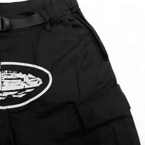 Corteiz cargo pants in a relaxed fit, featuring multiple pockets and a stylish design in a neutral color.