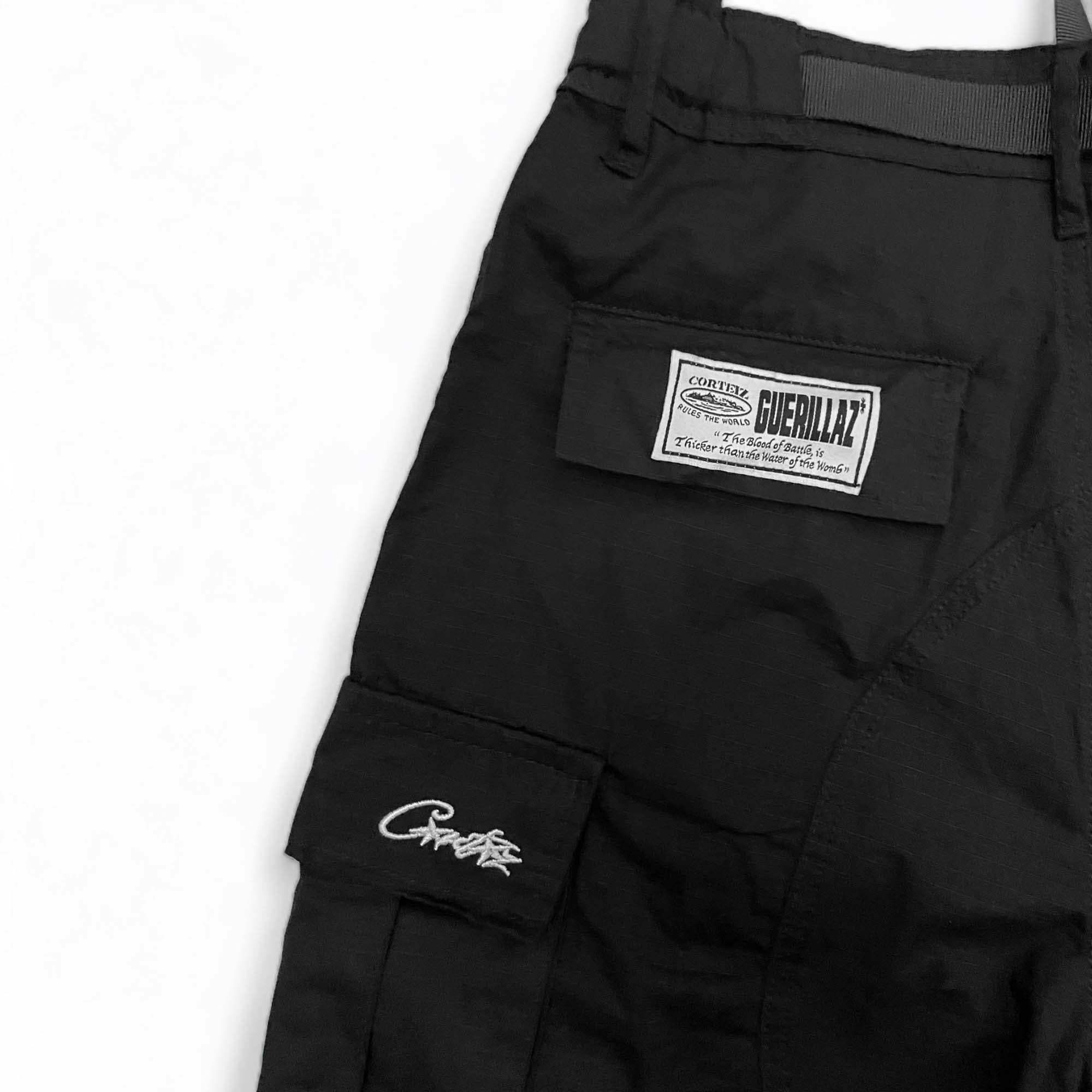 Corteiz cargo pants in a relaxed fit, featuring multiple pockets and a stylish design, perfect for casual wear.
