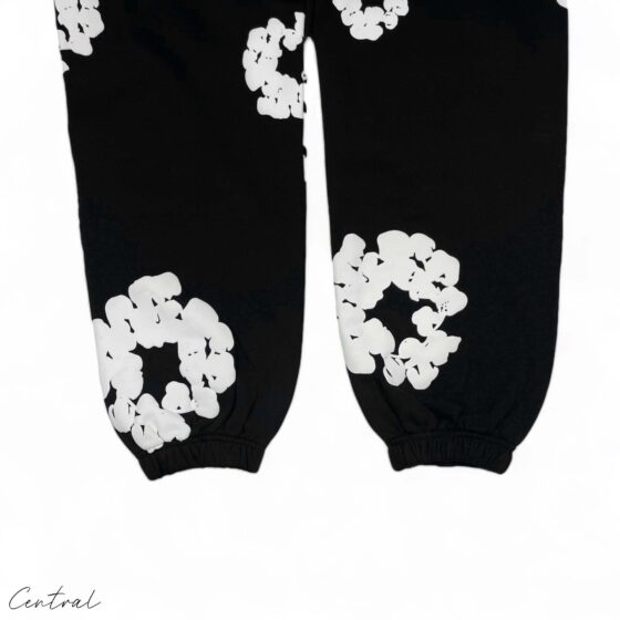Black sweatpants from Central AE featuring a cotton wreath design and a relaxed fit, perfect for casual wear.