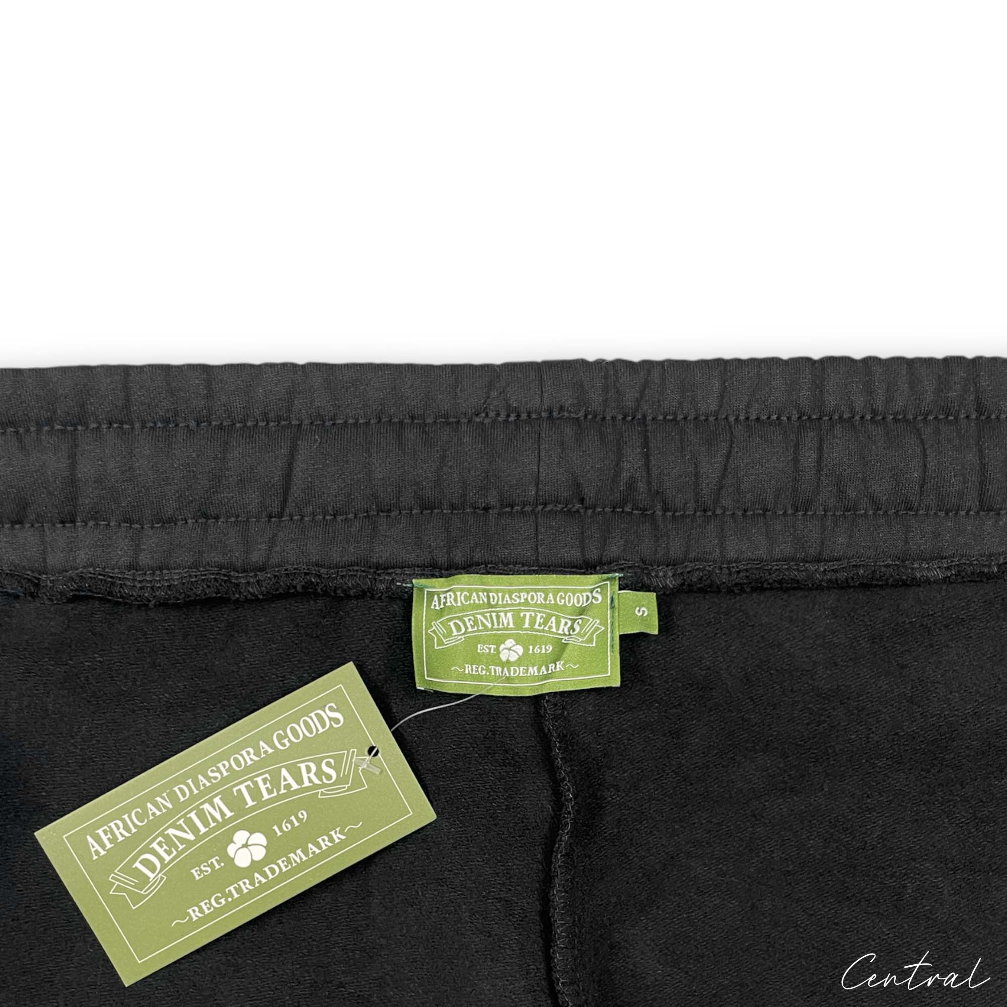 Black sweatpants from Central AE featuring a unique cotton wreath design. Perfect for casual and comfortable wear.