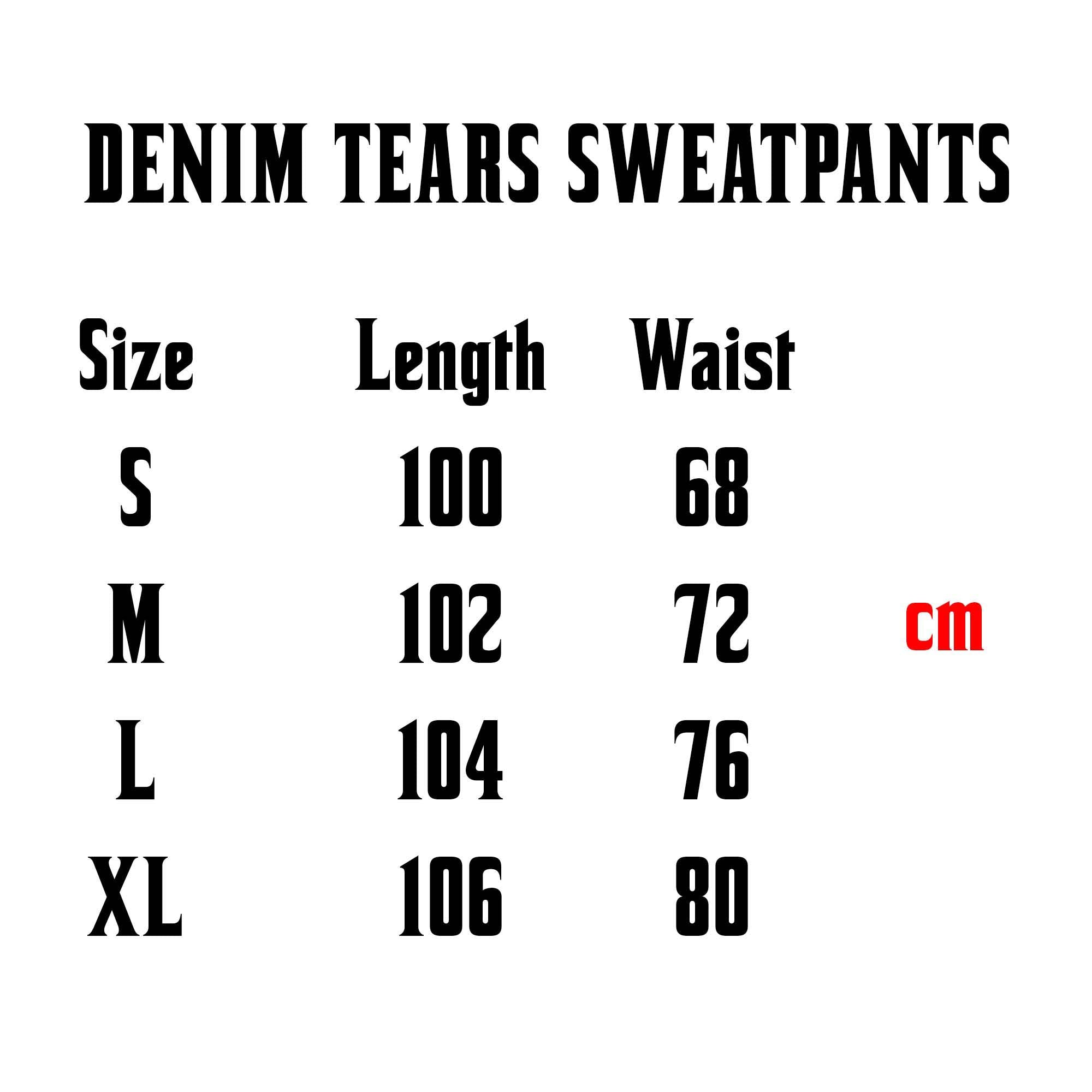 Black sweatpants from Central AE featuring a cotton wreath design, showcasing a relaxed fit and stylish look.