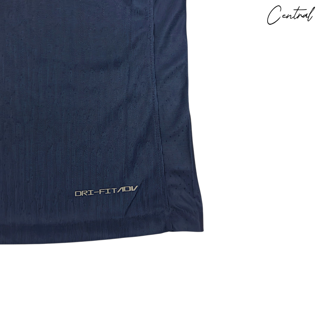 2025/26 Paris Saint-Germain home kit for players, featuring team colors and logo on a vibrant background.