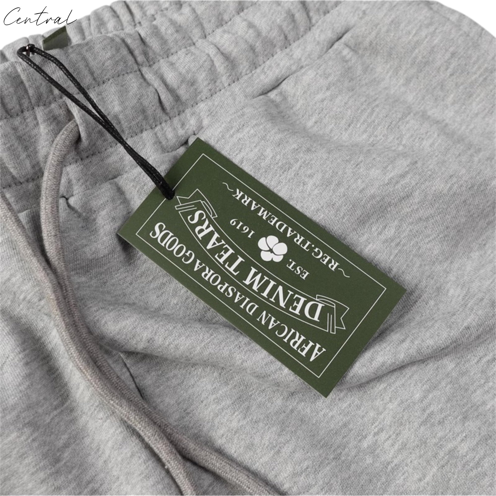 Gray sweatpants from Central ae featuring a unique cotton wreath design and relaxed fit.