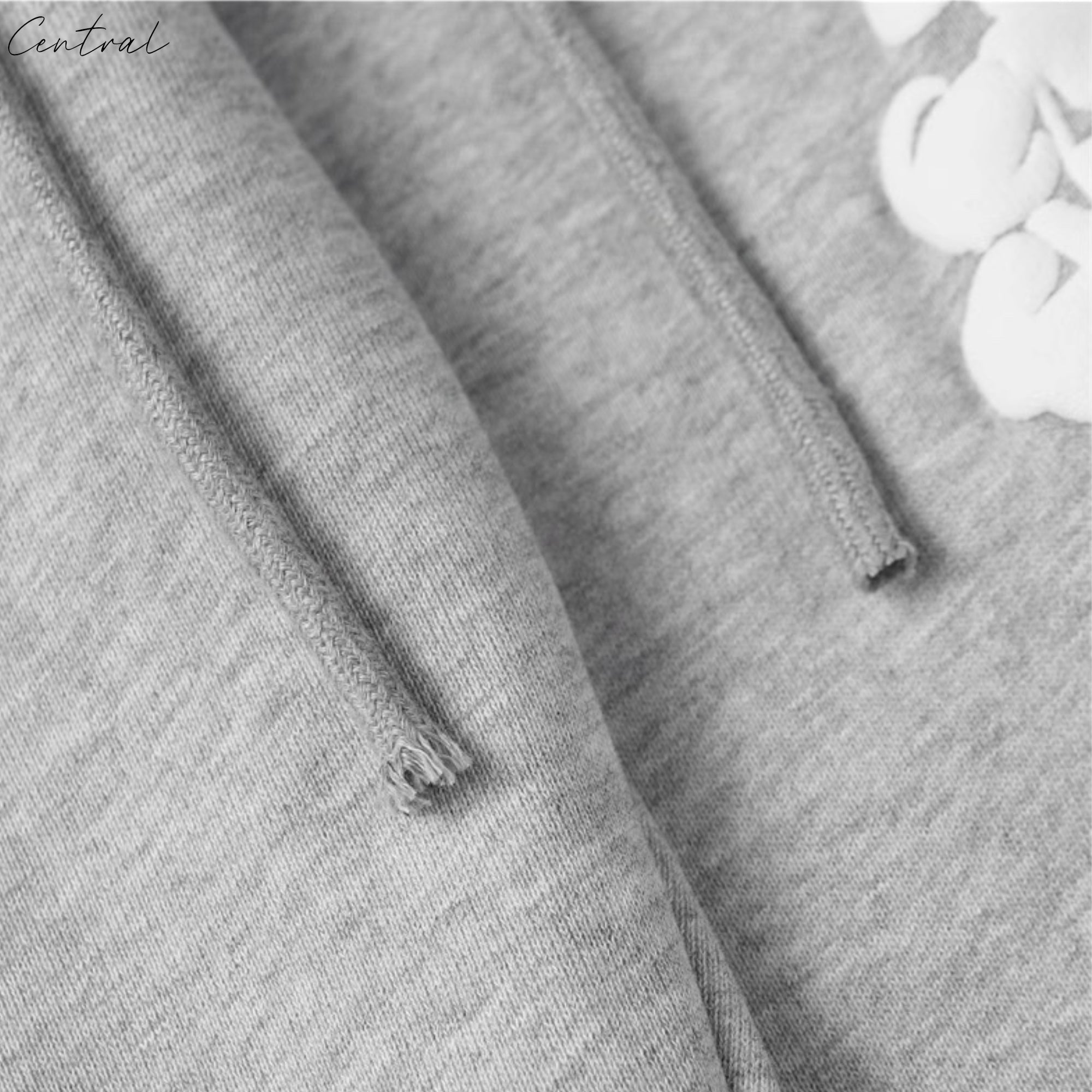 Gray sweatpants from Central ae featuring the Denim Tears Cotton Wreath design, showcasing a relaxed fit and soft fabric.