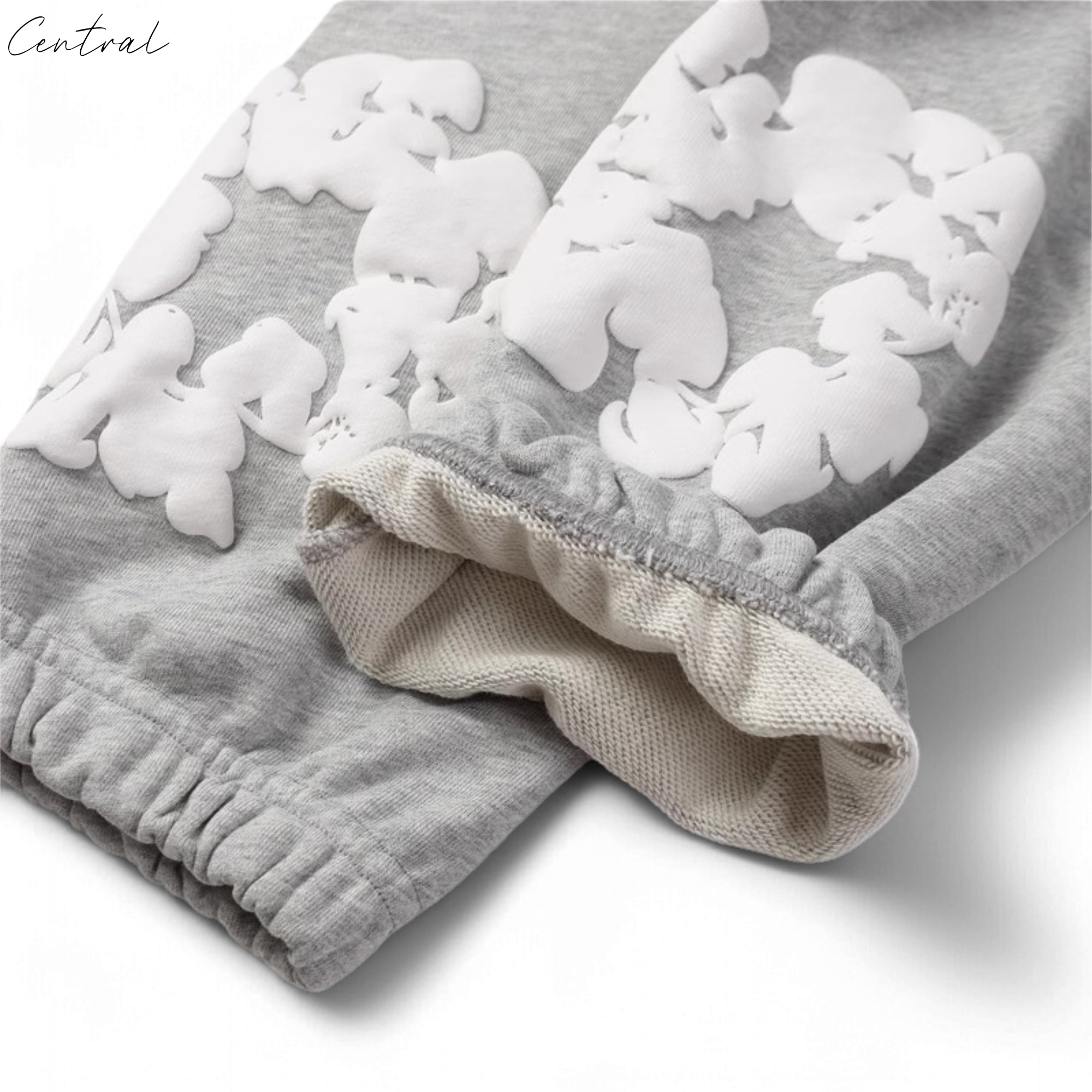 Gray sweatpants from Central ae featuring a cotton wreath design, displayed on a neutral background.