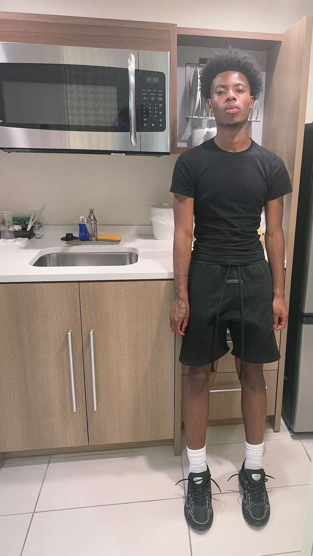 Essential black shorts from CENTRAL AE, featuring a relaxed fit and lightweight fabric for comfortable wear.