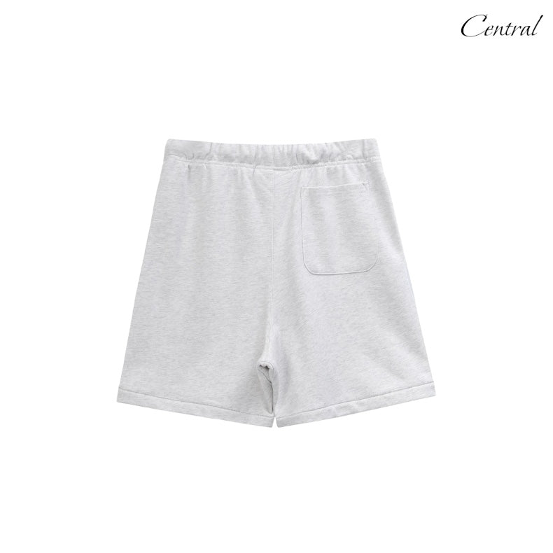 Light grey Essential Shorts by CENTRAL AE, featuring a relaxed fit and comfortable fabric for casual wear.