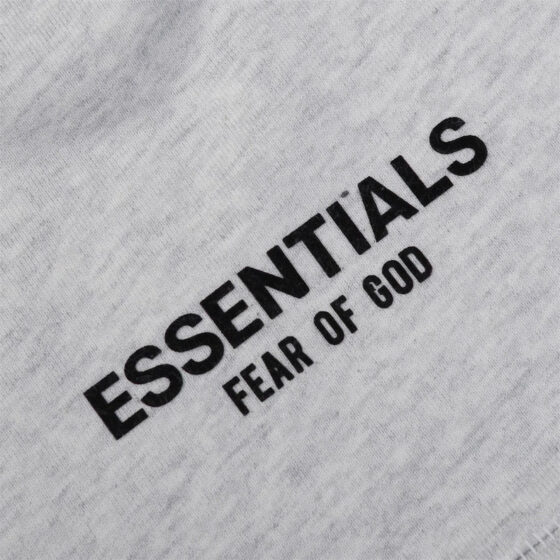Light grey Essential Shorts by CENTRAL AE displayed on a model, showcasing casual fit and comfortable fabric.