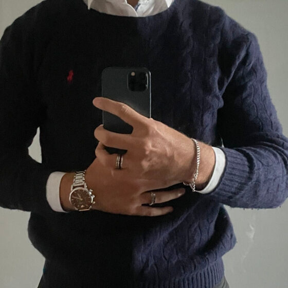 Navy cable-knit cotton jumper by Polo Ralph Lauren, showcasing a classic design and textured fabric.