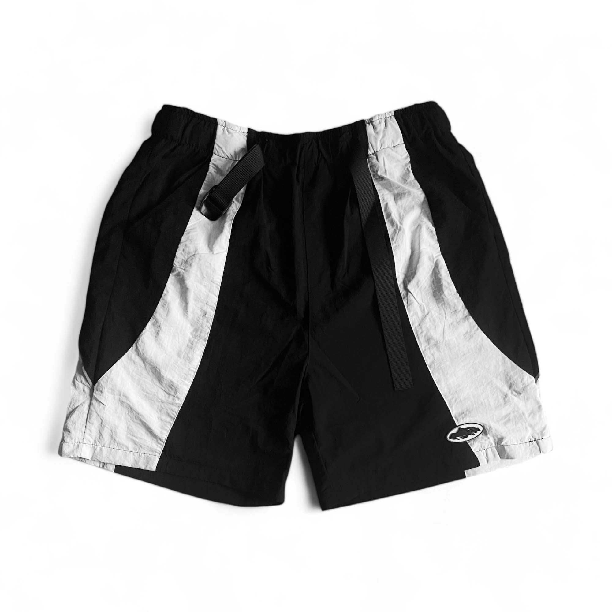 Black and white Corteiz Spring Shorts from Central ae, featuring a comfortable fit and stylish design.
