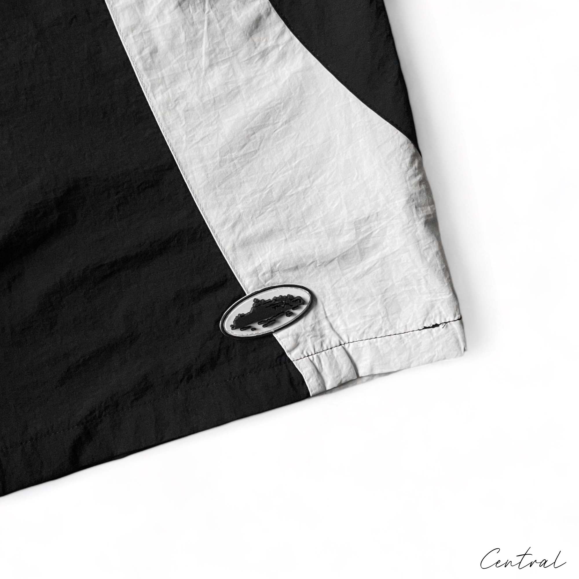 Corteiz black and white spring shorts by Central ae, featuring a relaxed fit and stylish design.