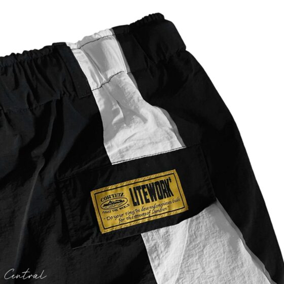 Black and white Corteiz spring shorts by Central ae, featuring a relaxed fit and stylish design.