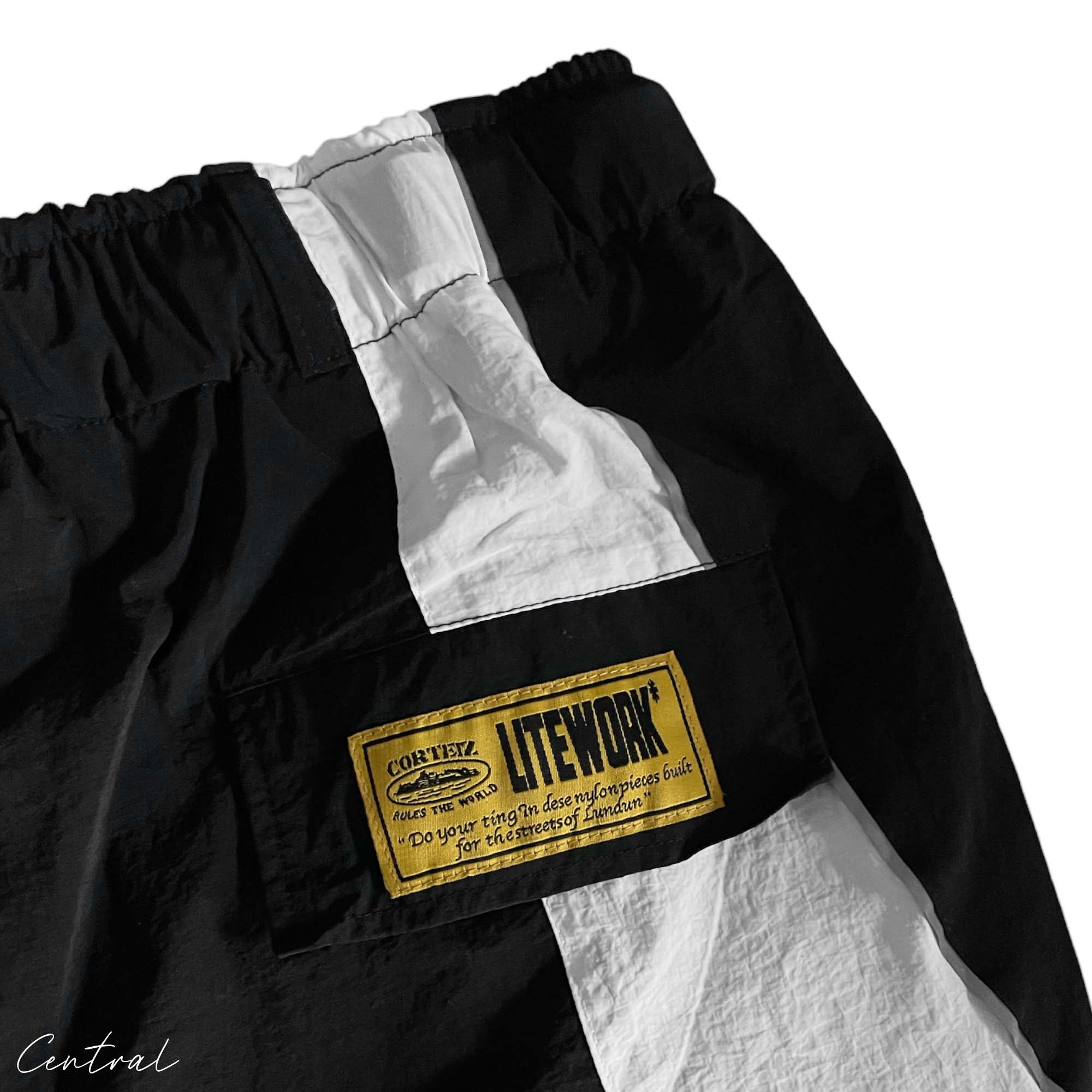 Black and white Corteiz spring shorts by Central ae, featuring a relaxed fit and stylish design.