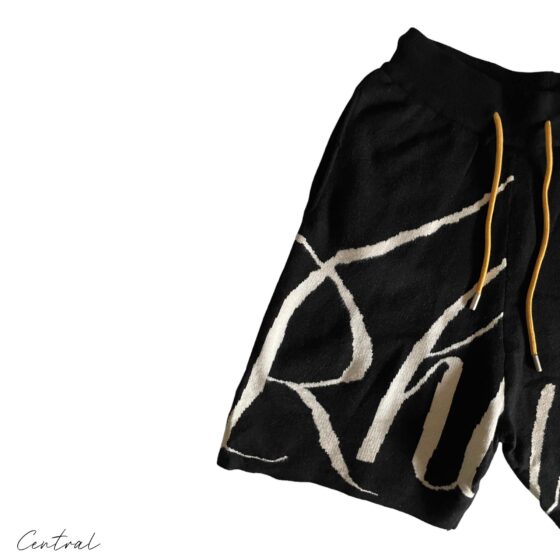 Black and cream Rhude knit logo shorts featuring a comfortable fit and stylish design.