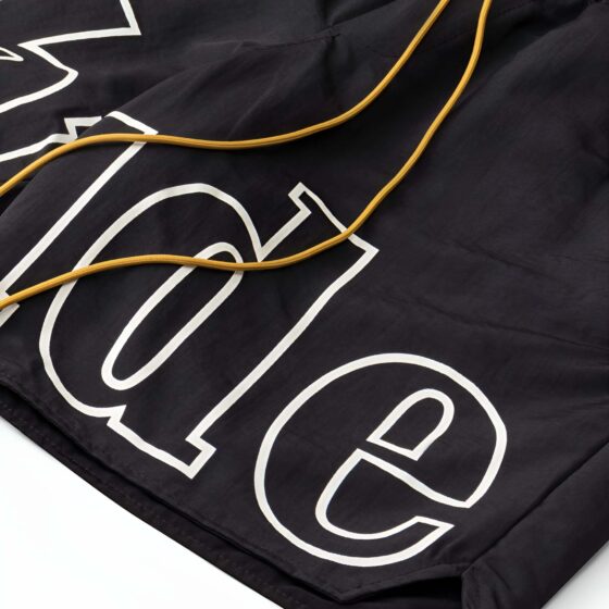 Black Rhude shorts displayed on a neutral background, featuring a relaxed fit and stylish design.