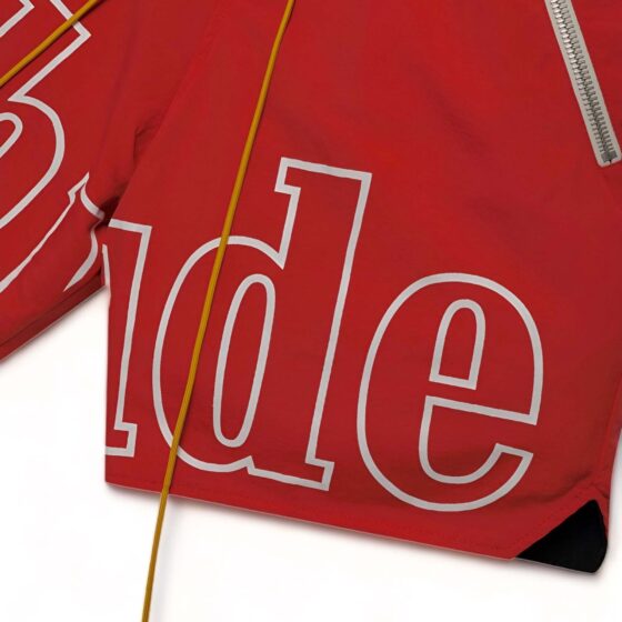 Red Rhude shorts featuring a relaxed fit and stylish design, perfect for casual summer wear.