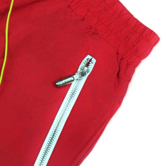Red Rhude shorts displayed on a neutral background, showcasing a relaxed fit and contemporary design.