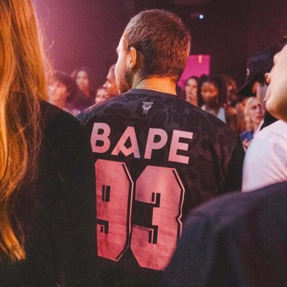 BAPE x Inter Miami black camo t-shirt featuring a unique design by Central ae, displayed on a neutral background.