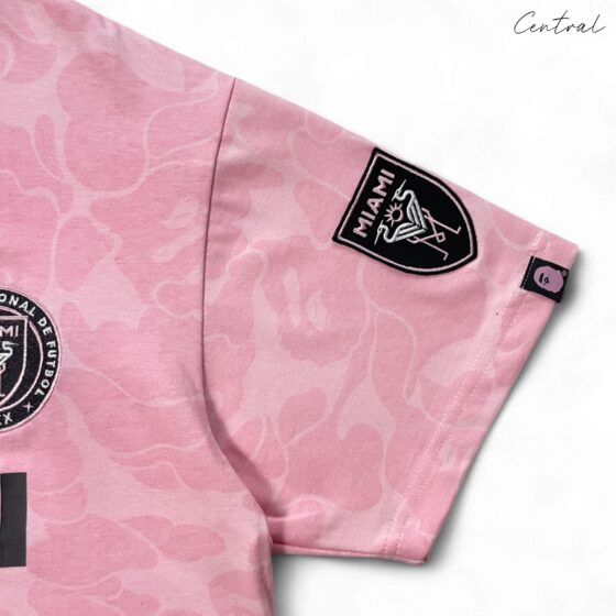 BAPE x Inter Miami pink camo t-shirt featuring a unique camouflage pattern and logo from Central ae.