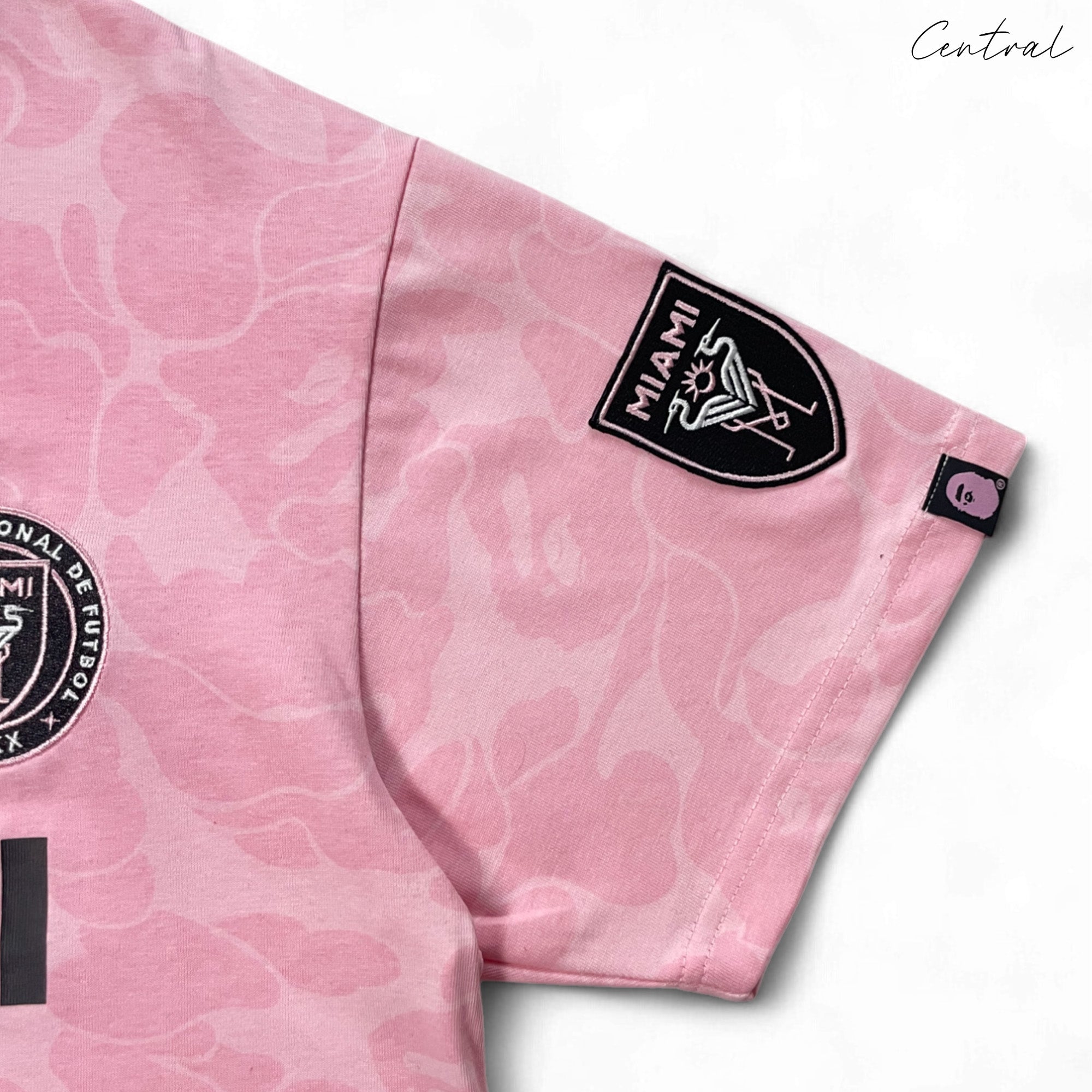 BAPE x Inter Miami pink camo t-shirt featuring a unique camouflage pattern and logo from Central ae.
