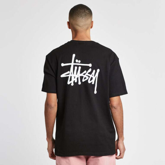 Black basic Stüssy tee featuring a classic crew neck and relaxed fit, displayed on a neutral background.
