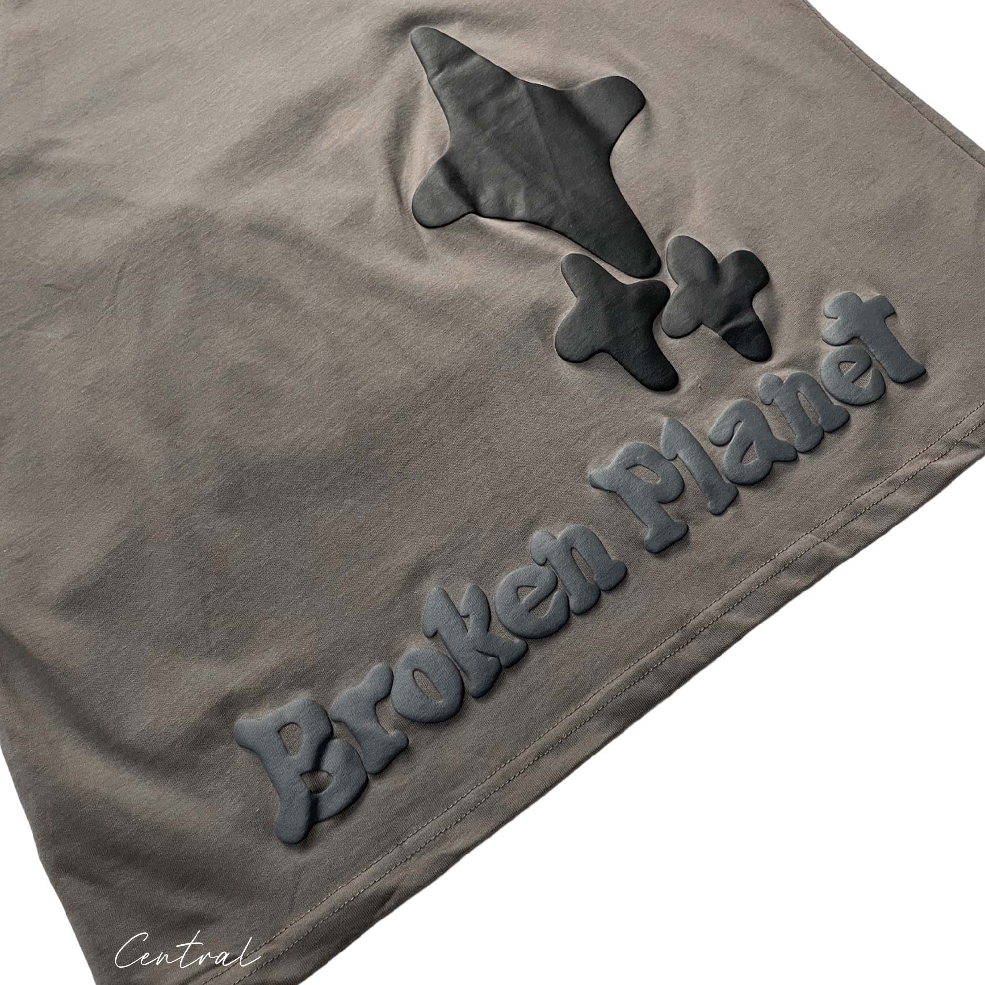 Central ae Out of the Shadows T-shirt featuring a unique graphic design on a relaxed-fit style.