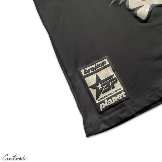 Central ae Broken Planet Total Chaos T-shirt featuring a vibrant graphic design on a casual black tee.