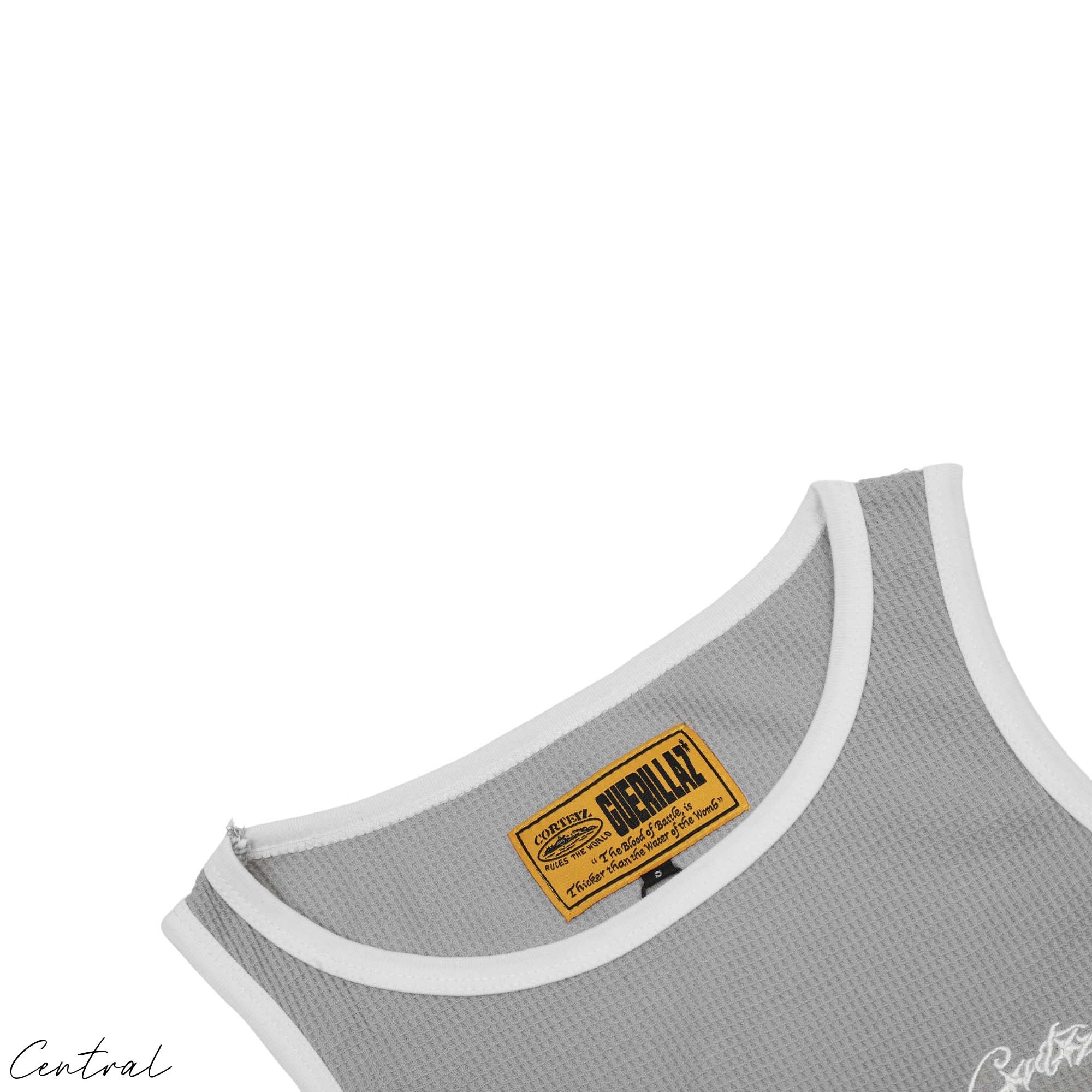 Corteiz Contrast Tank Top in black and white, featuring a relaxed fit and logo detail from Central ae.
