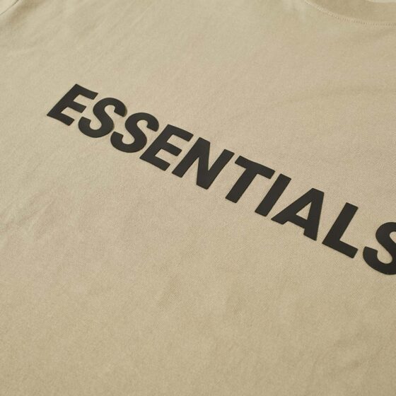 Khaki oversized FOG ESSENTIALS T-shirt displayed on a flat surface, showcasing its relaxed fit and soft fabric.