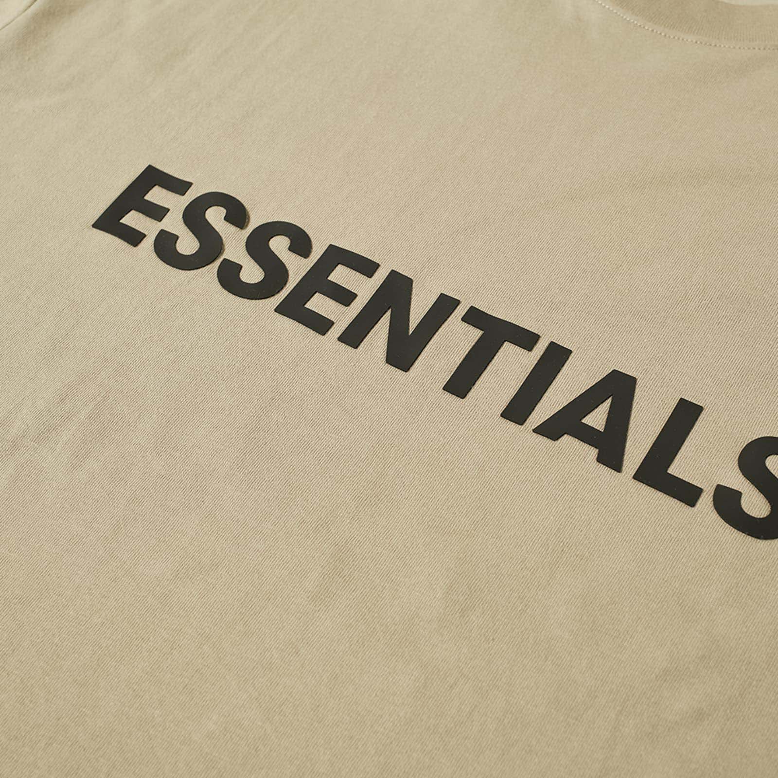 Khaki oversized FOG ESSENTIALS T-shirt displayed on a flat surface, showcasing its relaxed fit and soft fabric.