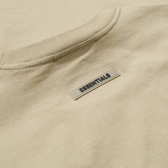 Khaki oversized FOG ESSENTIALS T-shirt featuring a relaxed fit and soft fabric, perfect for casual wear.